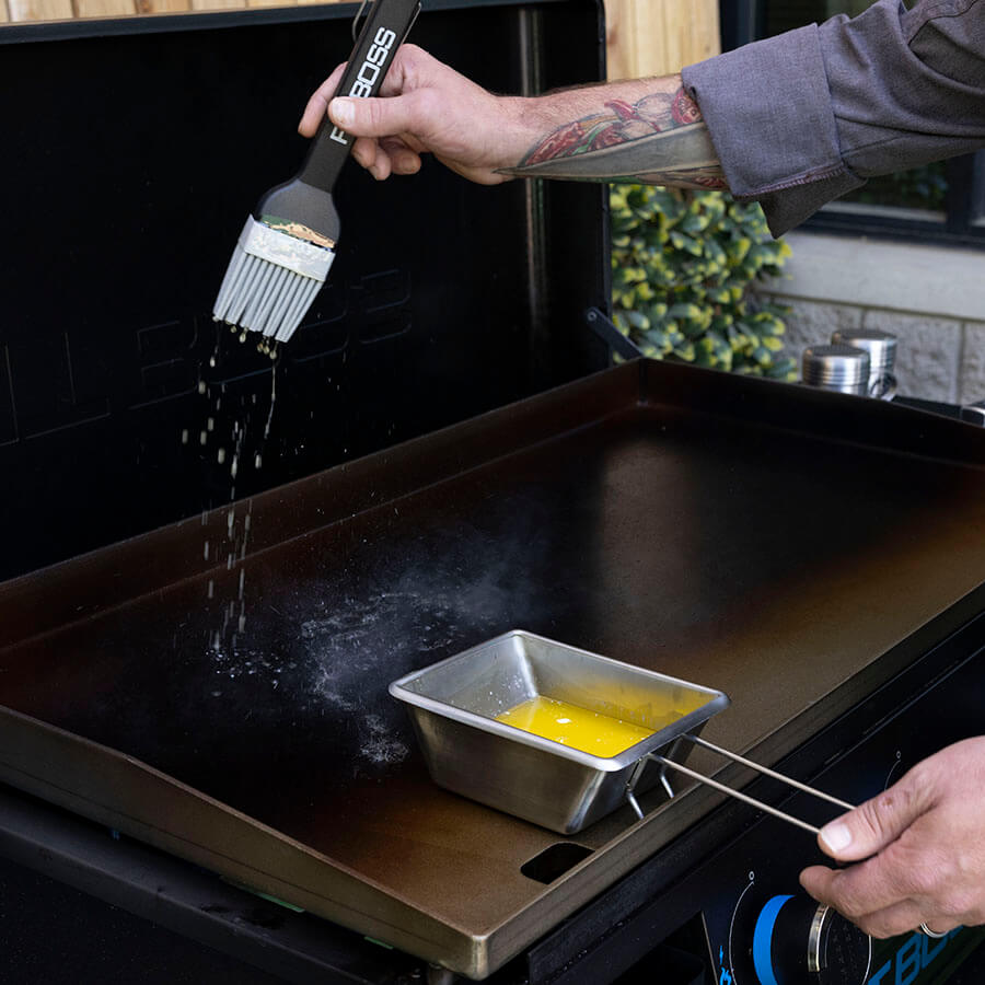  butter inside griddle sauce pot. Brush dripping butter onto hot griddle.