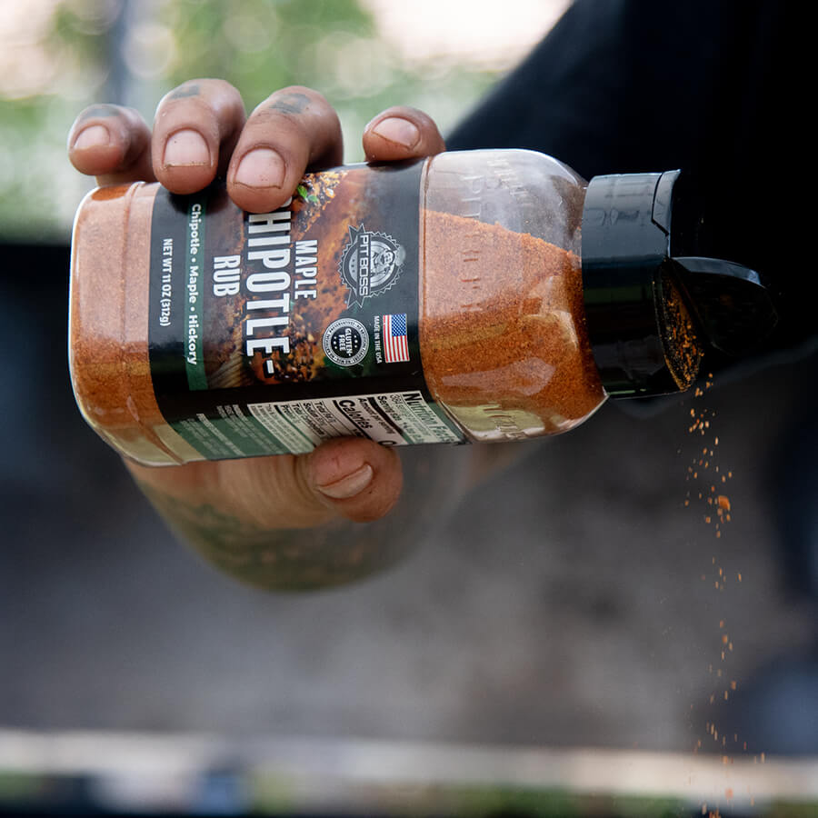 pit boss maple chipotle rub being poured out of open bottle