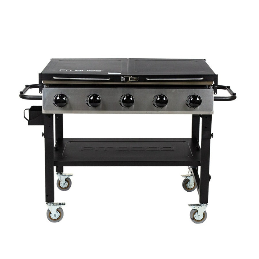 black and silver griddle with tan griddle top. shelves folded in