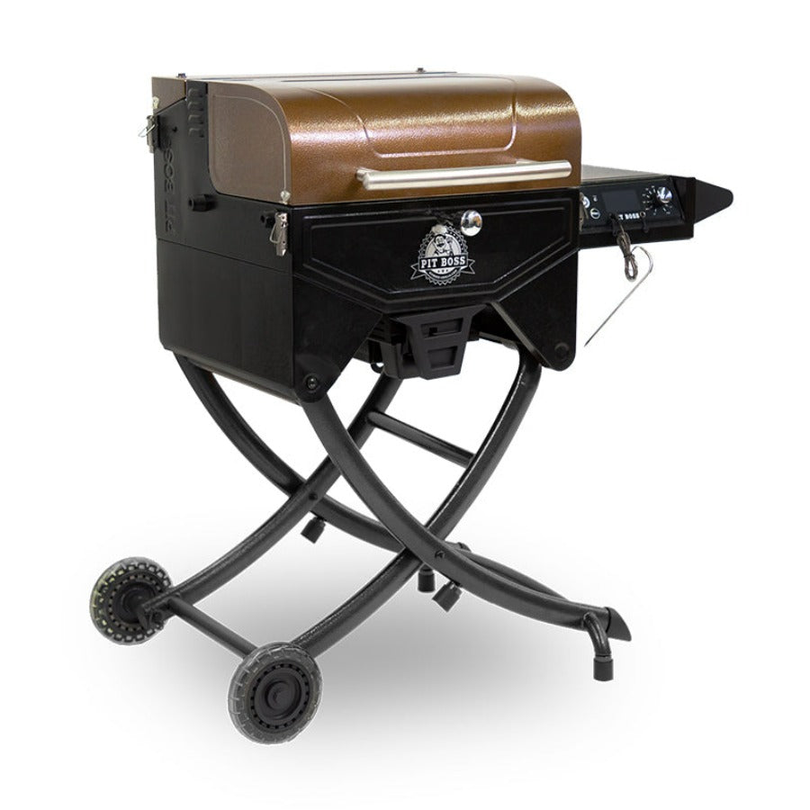 lifestyle_2, Orangeish-brown and black grill with silver accents and Pit Boss logo. Side angle view