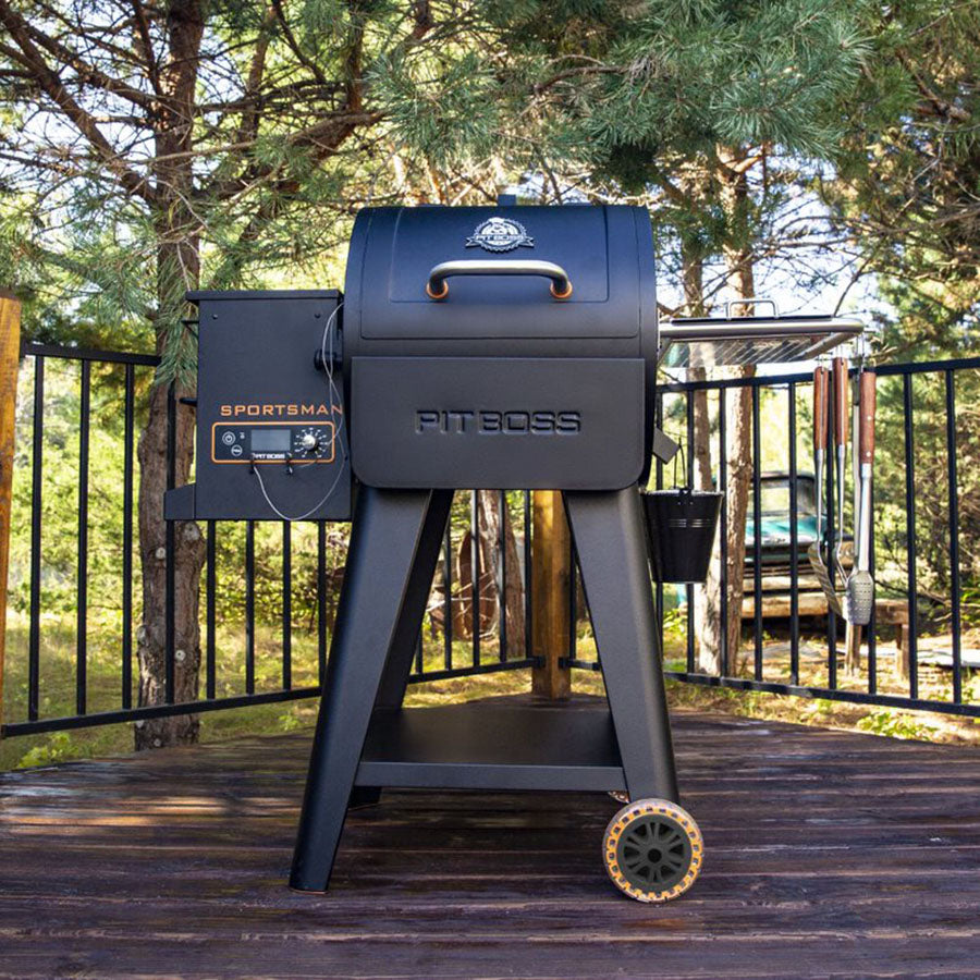 grill standing on porch with woodsy background