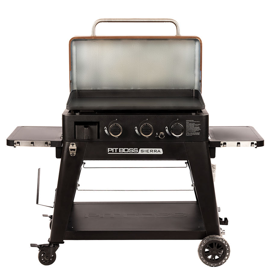lifestyle_1, Black griddle with silver and orangeish-tan accents. Grill hood open