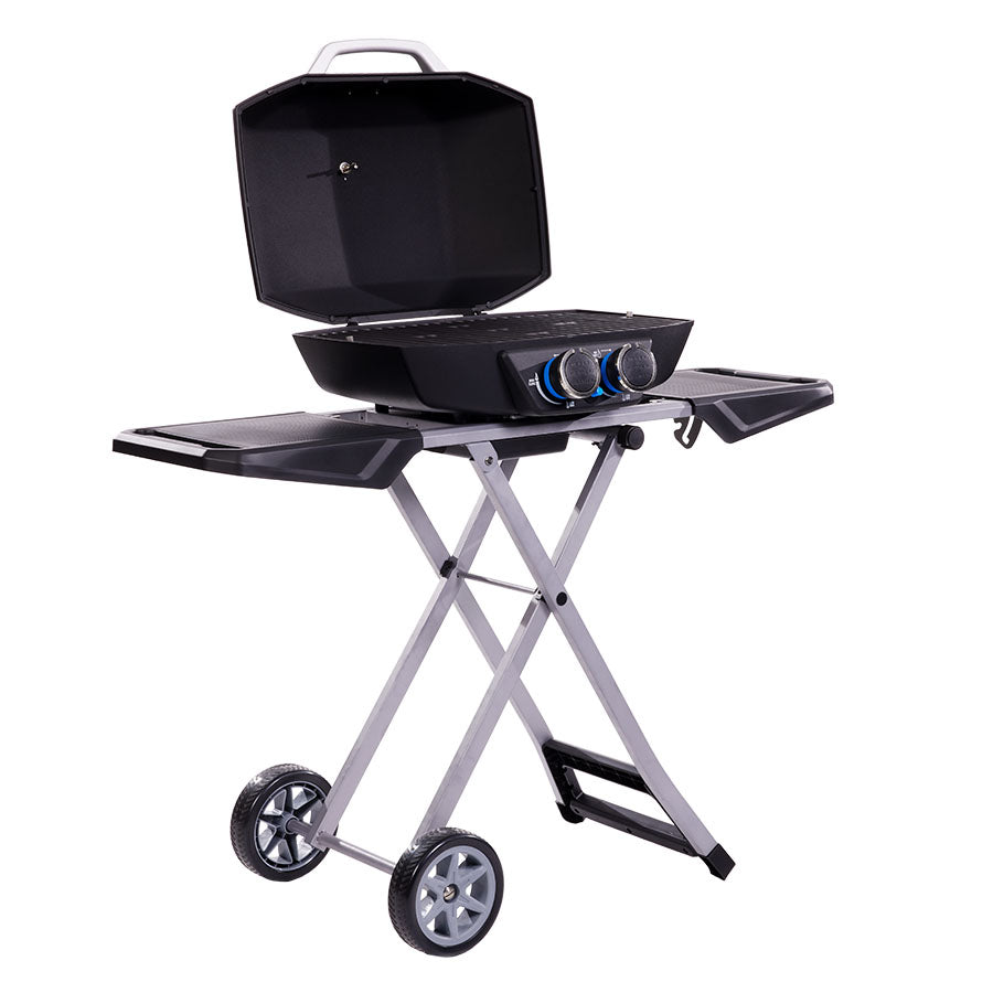 lifestyle_1, Black and silver grill with blue accents and small Pit Boss logo. Side angle view. Grill hood open