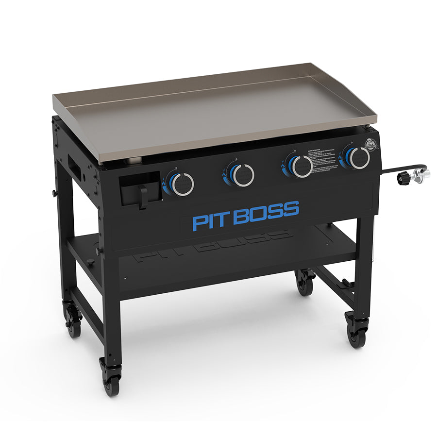 Black griddle with blue accents. Pit Boss name labeled across the side of the griddle. No propane plugged in. Higher view.