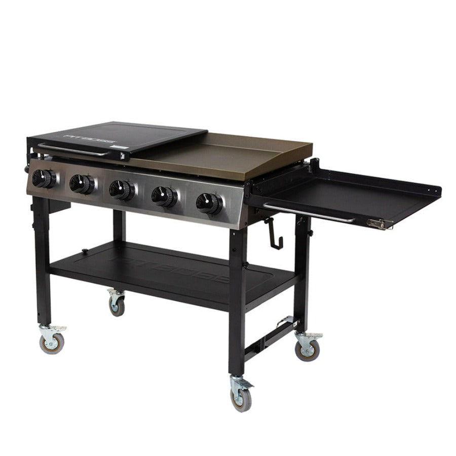 black and silver griddle with tan griddle top. one shelf folded