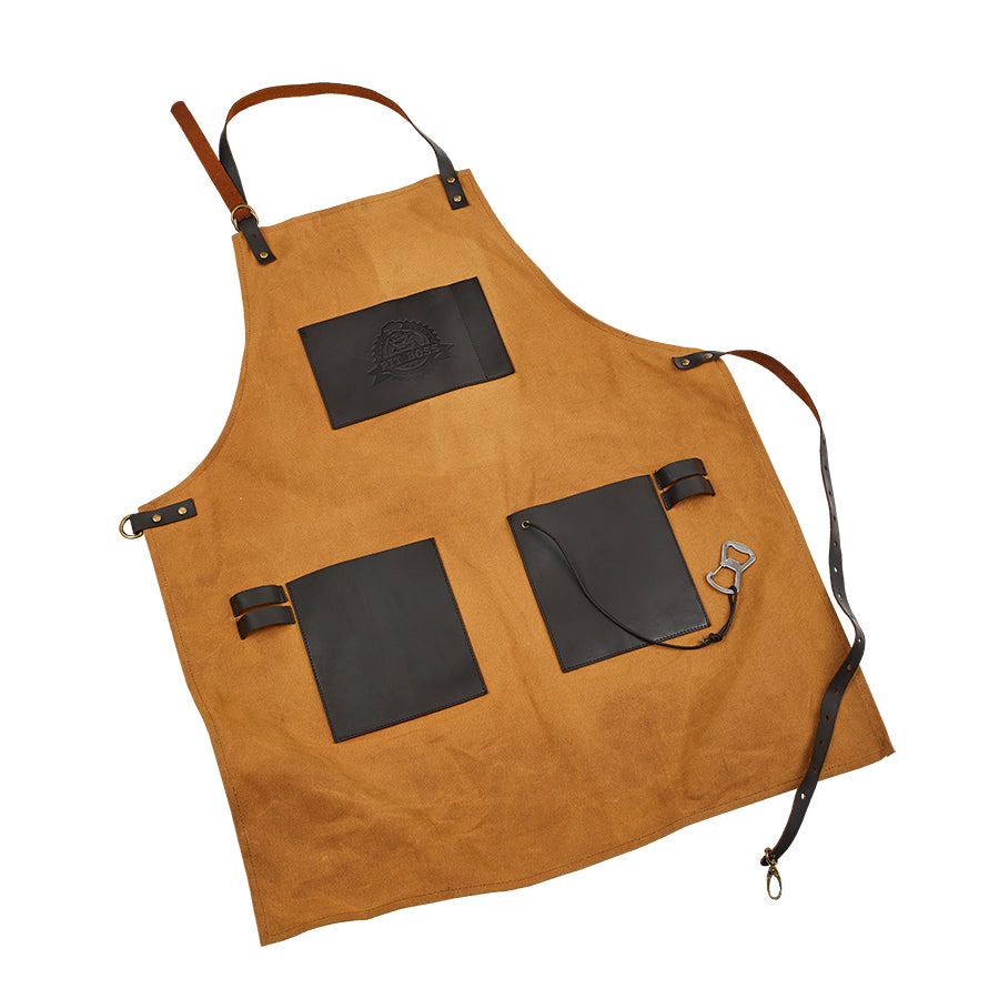 Orangeish brown apron with dark brown leather pockets and pit boss logo on front