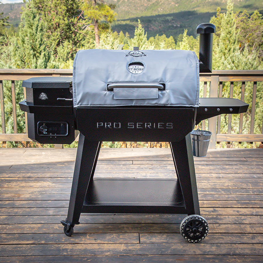 silver grey bbq grill insulated blanket  on grill on deck in woods