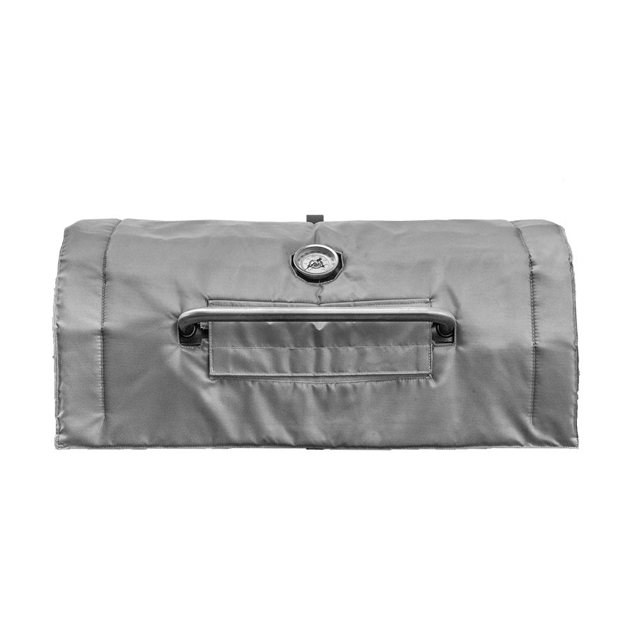 Silvery grey grill blanket with holes for thermometer gauge and hood handle
