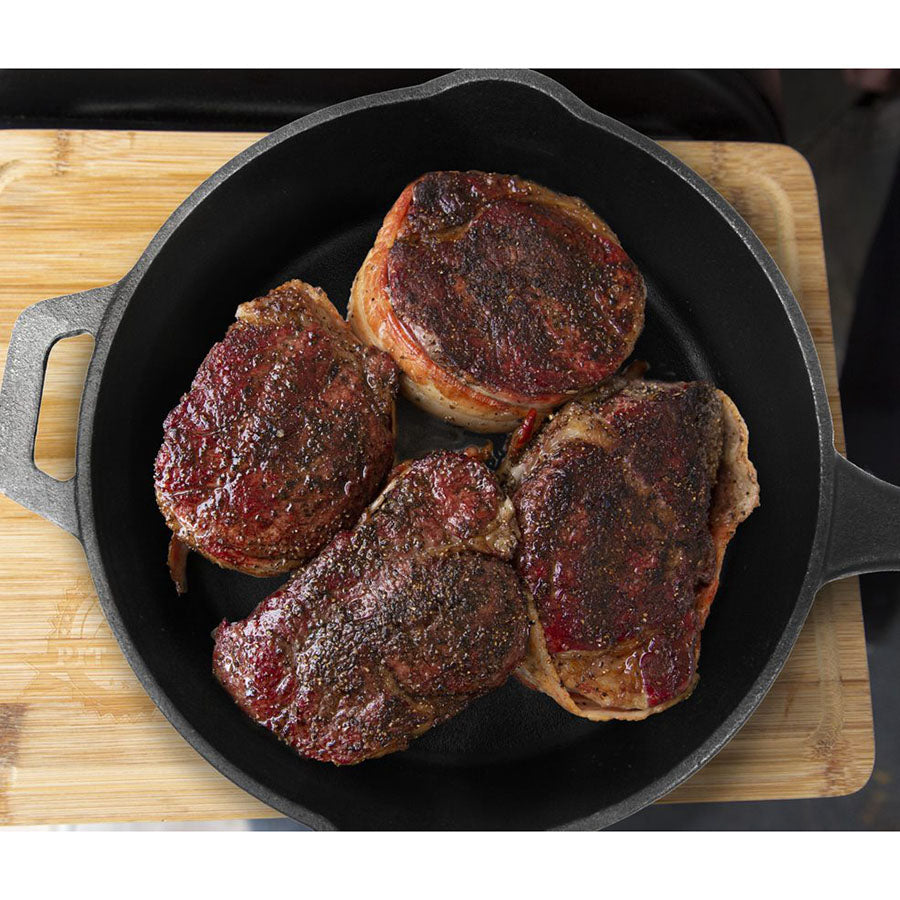 4 steaks fully cooked in cast iron skillet