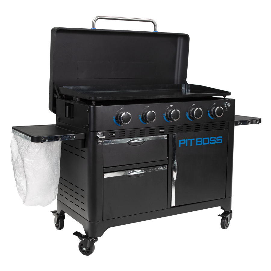 lifestlye_5, Black griddle with bright blue and silver accents with large blue "pit boss" logo. Shown with trash bag holder and trash bag. Side view. Griddle hood open