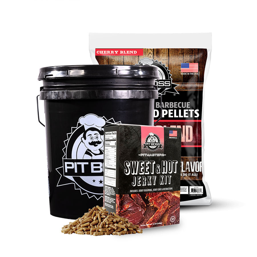 The Pit Boss Pit Master Sweet & Hot Jerky Bucket Kit comes with a 5 gallon all-weather storage bucket that can hold up to 20+ lbs of wood pellets with a lid, a sweet and hot jerky prep seasoning kit, and 20 lbs. of Cherry Blend Hardwood Pellets.  Black bucket with red pellets.