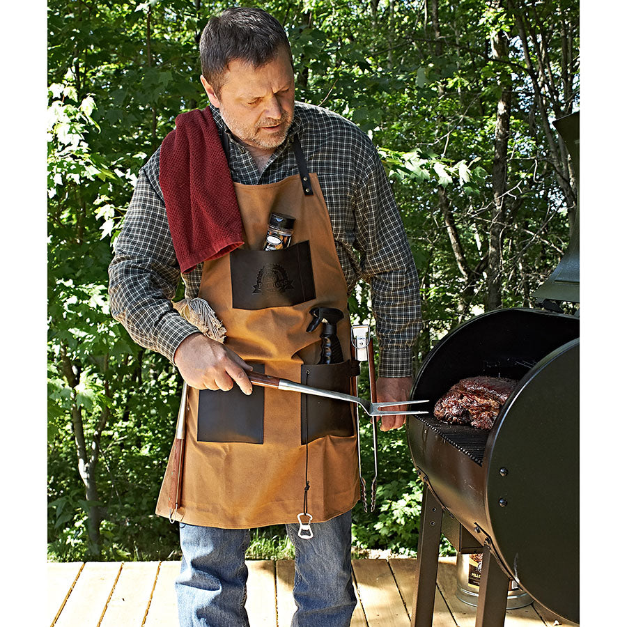 lifestyle_1, man wearing apron while grilling