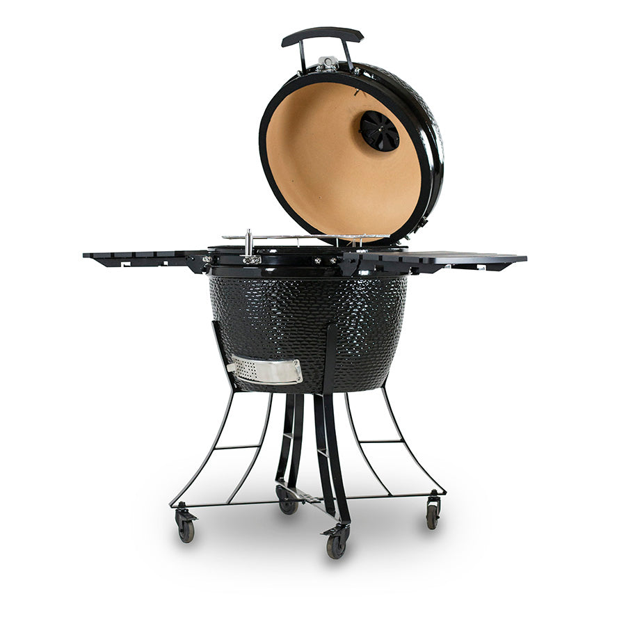 lifestyle_1, All black charcoal grill with bumpy texture and silver accents. Hood open, side angle. 