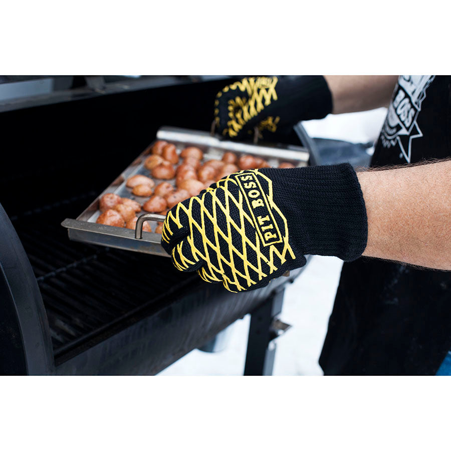lifestyle_1, using gloves to pull tray of food out of grill