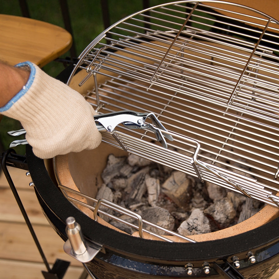 lifestyle_1, using griddle gripper to lift up grates on charcoal grill