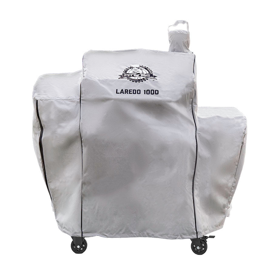 Silvery white cover with black accents, pit boss logo and 'laredo 1000' lettering on front