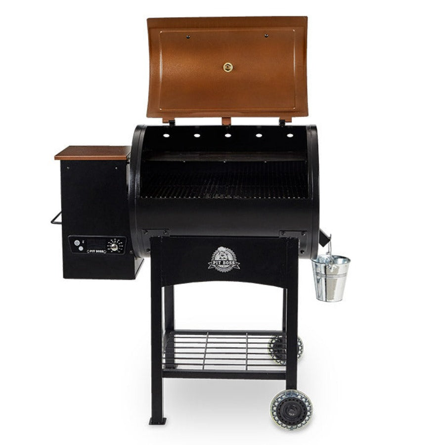lifestyle_1, orangeish-brown and black grill with silver accents and Pit Boss logo. Grill hood open