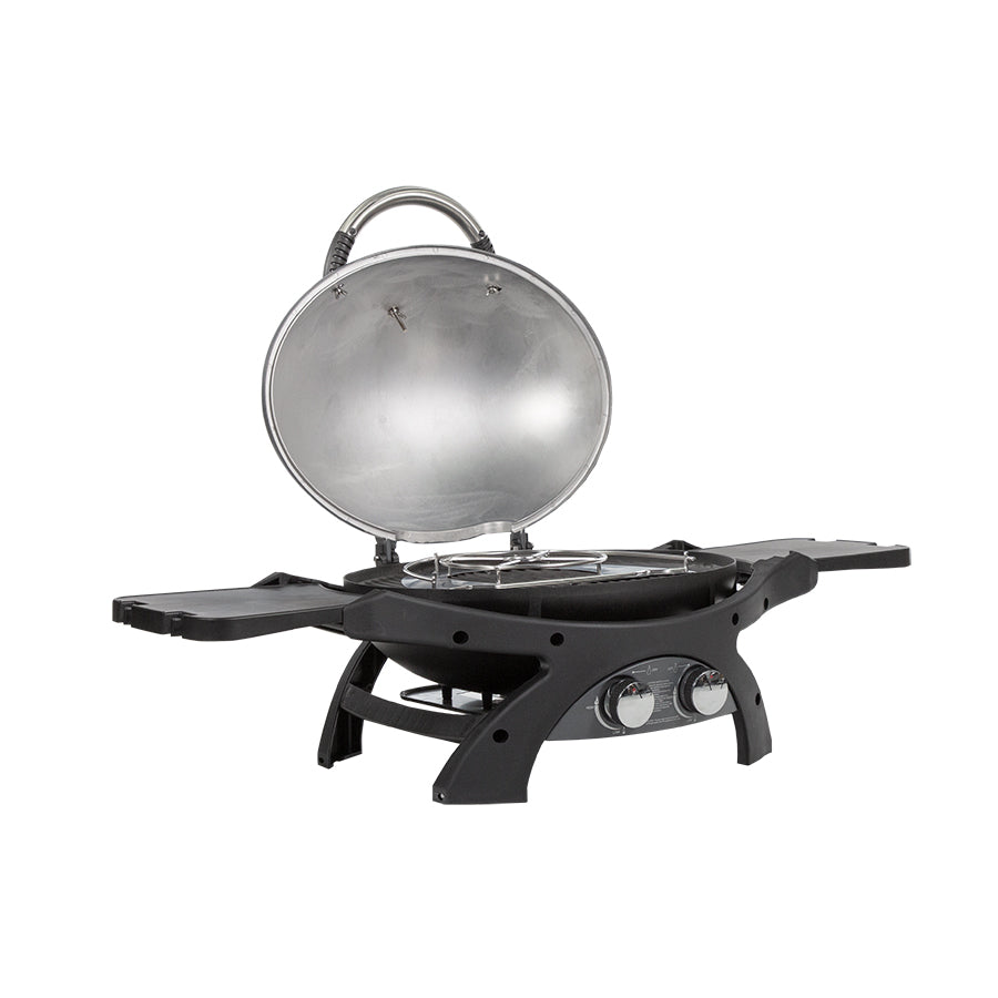lifestyle_1, Dark grey and black portable grill with silver accents. Grill hood open to reveal burner